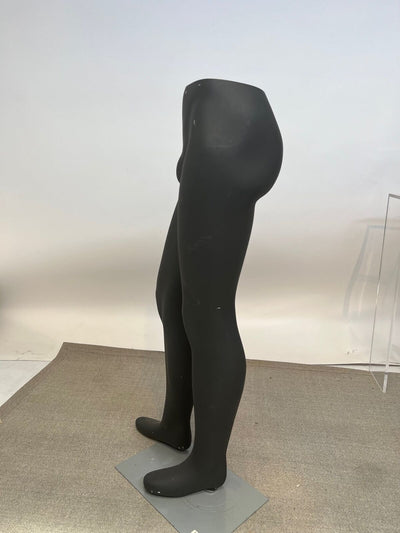 Used male mannequin leg on a stand.